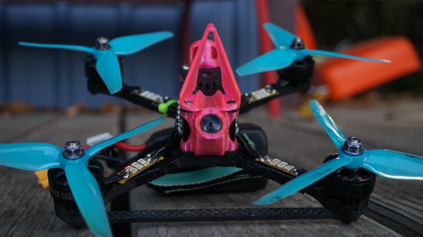 FPV drone Jude built, pink canopy and teal props